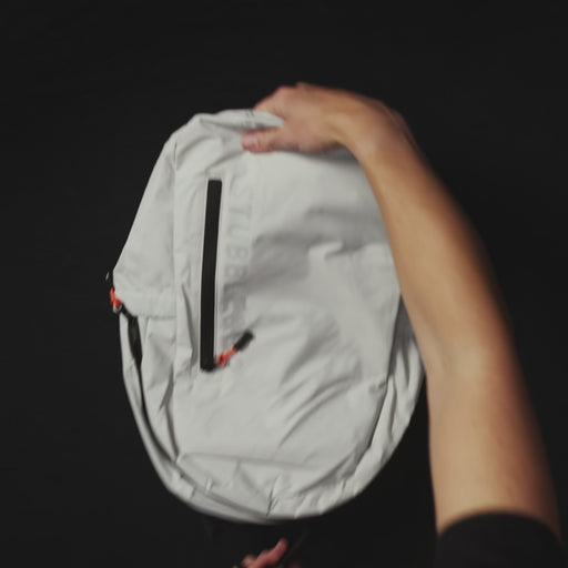 How to pack and fold the Ultra Light Backpack packable, which comes in Off White and All Black