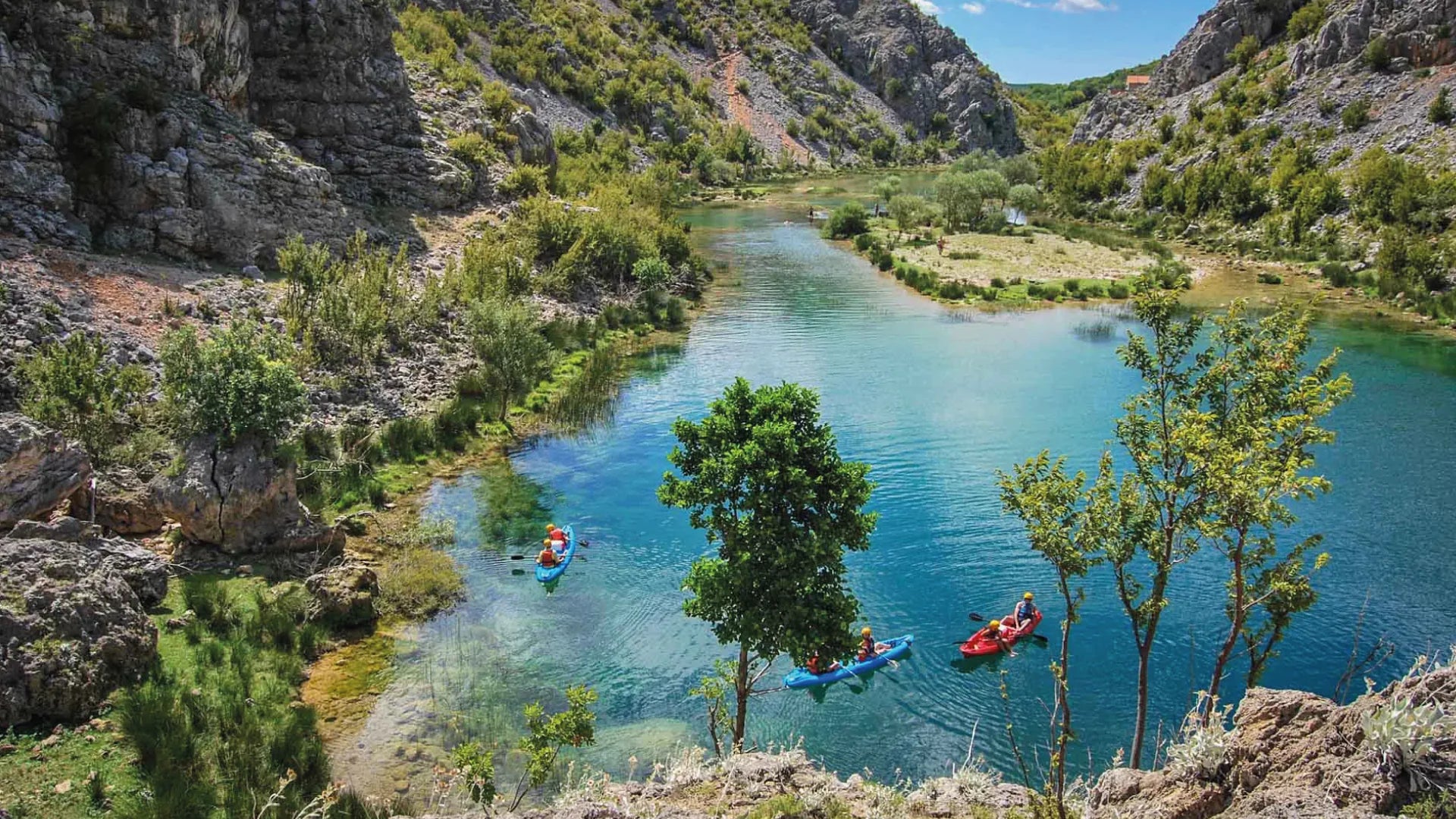 A lake in Croatia where people are Kayaking