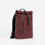 A studio shot of the front and side of the garnet red roll top 15l- shop all