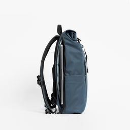 Side view of the Roll Top 15L in Tasmin Blue showing laptop compartment