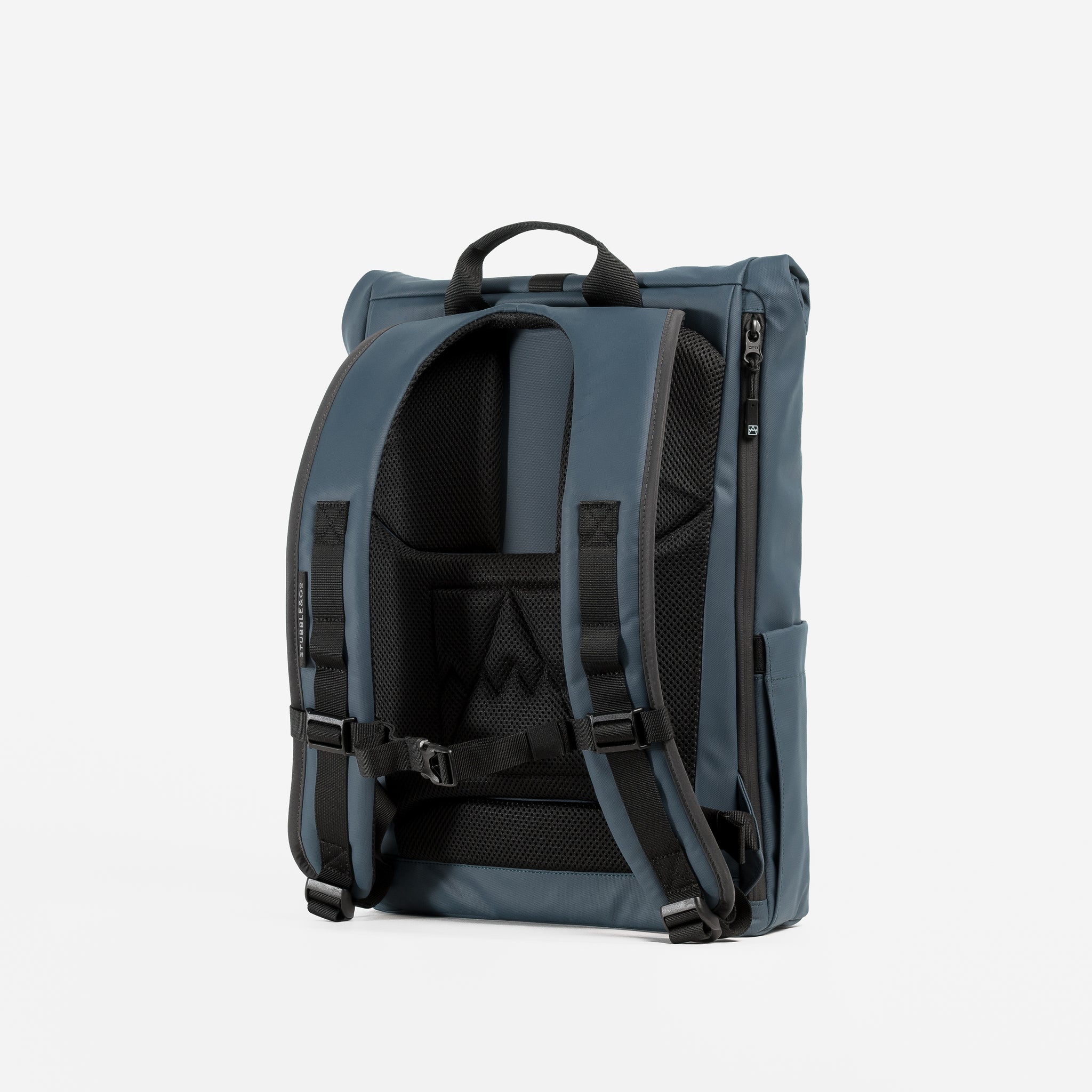 A studio shot of the Tasmin Blue Roll Top 15Ls adjustable chest straps and back panel