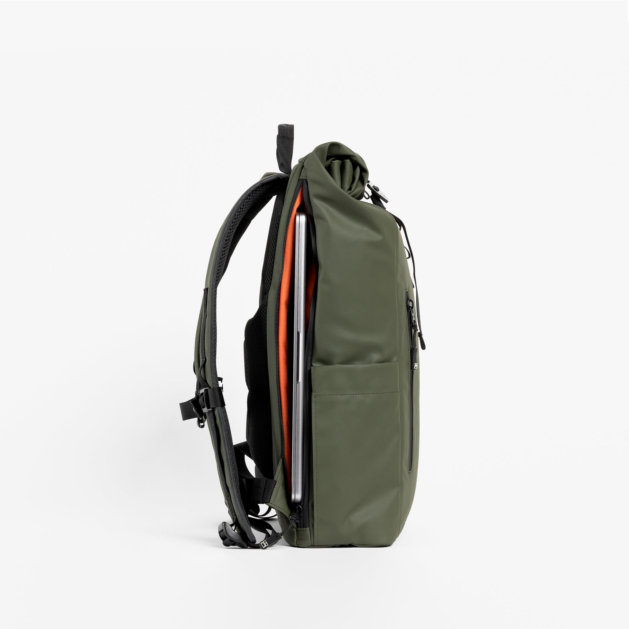Side view of the Roll Top 15L in Urban Green with laptop compartment