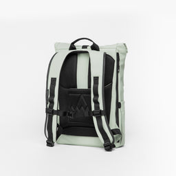 A studio shot of the adjustable chest strap and back panel on the Soft Mint Roll Top 15L