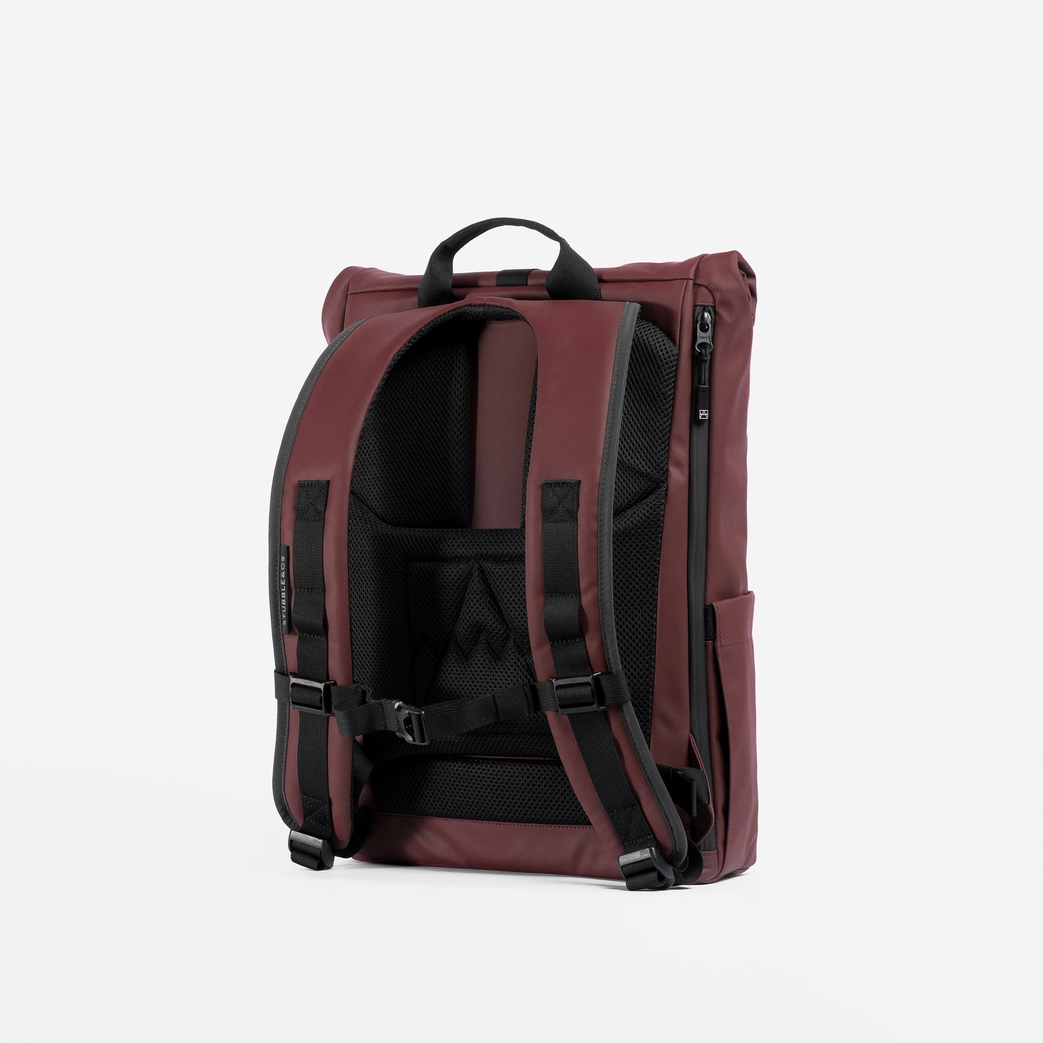 A studio shot of the back panel and adjustable chest straps on the Garnet Red Roll Top 15L