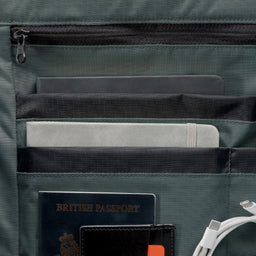 A studio shot of the interior organisation and dark pearl lining within the Roll Top 15L in Tonal Sand