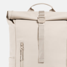 A studio shot of the close up of the g-hook and roll on the Roll Top 15L in Tonal Sand