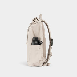A studio shot of the side bottle pocket on the Tonal Sand Roll Top 15L