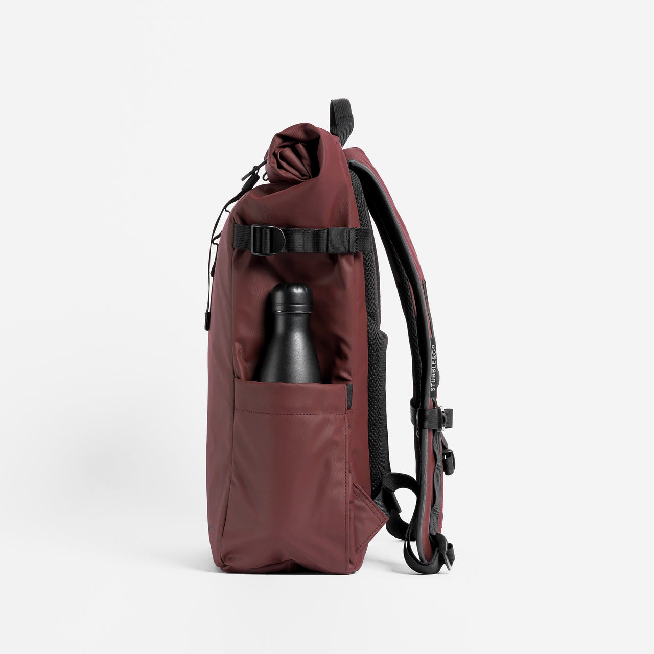 A studio shot of the side bottle pocket on the Roll Top 20L in Garnet Red