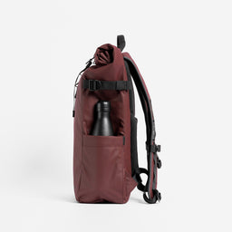 A studio shot of the side bottle pocket on the Roll Top 20L in Garnet Red