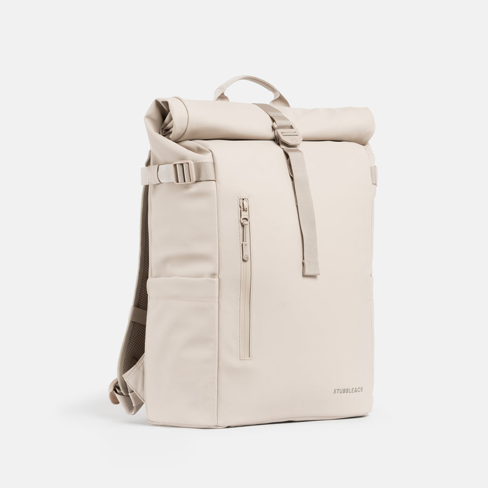 A studio shot of the front and side of the Tonal Sand Roll Top 20L