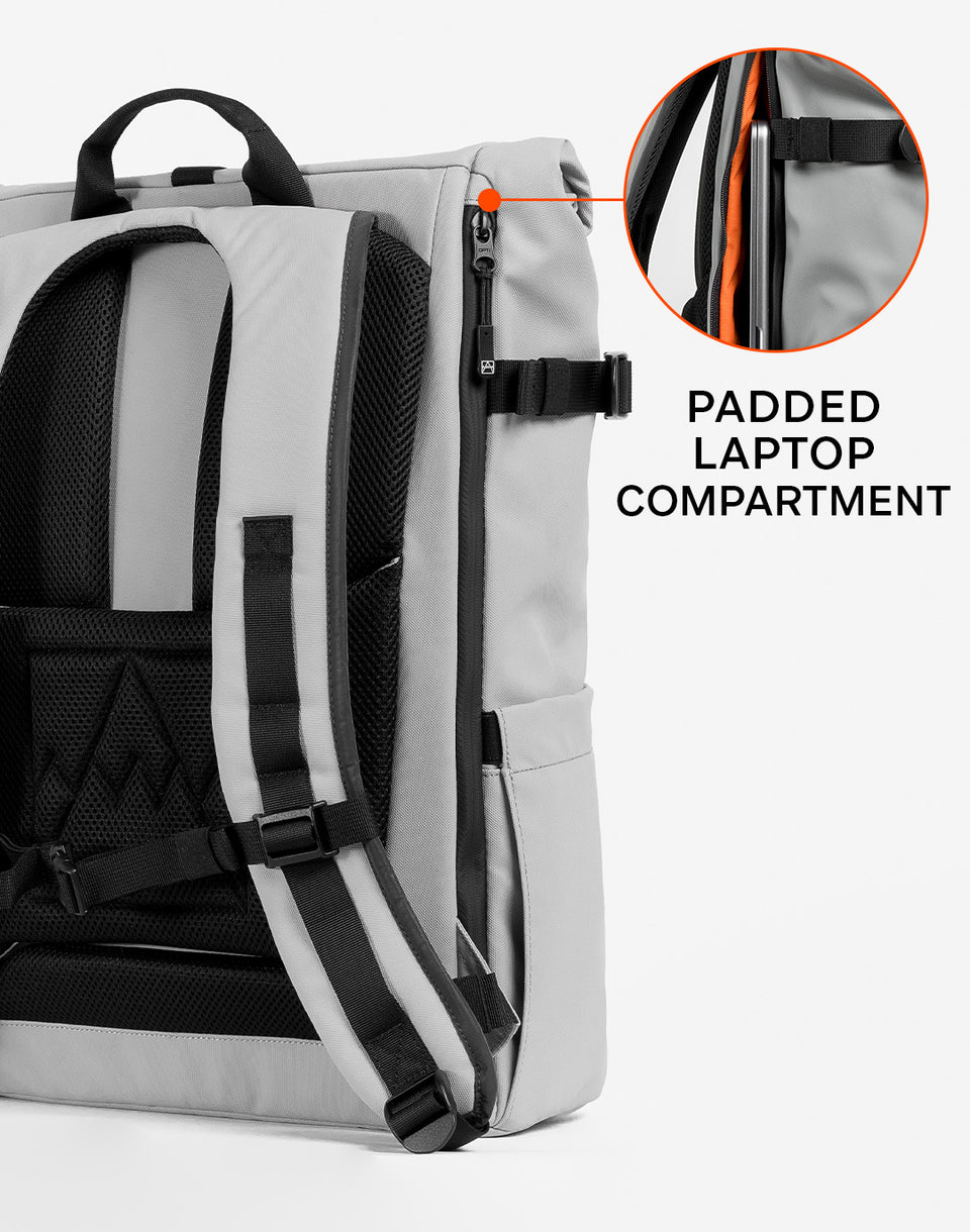 Back view of a roll top backpack with annotation saying padded laptop compartment