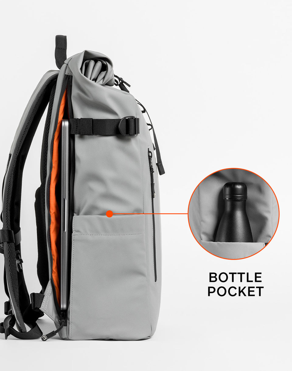 Close up of a Roll Top backpack with annotation highlighting the bottle pocket
