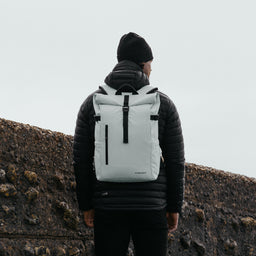 Man wearing The Roll Top 20L in Arctic White