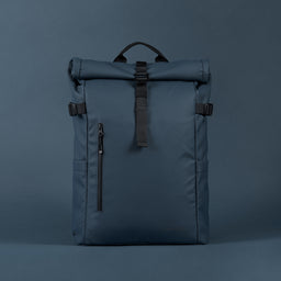 Front view of The Roll Top 20L backpack in Tasmin Blue