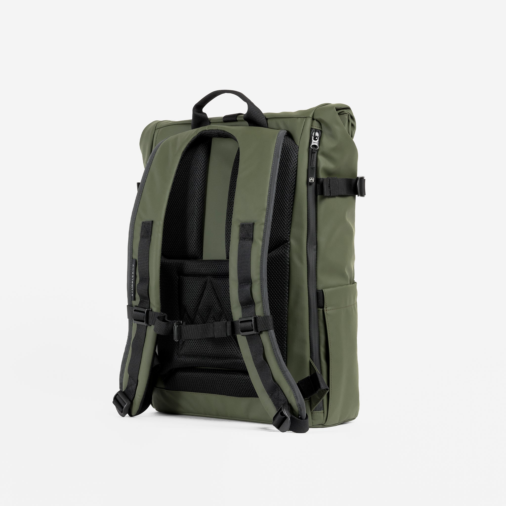 A studio shot of the back panel and adjustable chest strap on an Urban Green Roll Top 20L In Urban Green