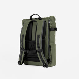 A studio shot of the back panel and adjustable chest strap on an Urban Green Roll Top 20L In Urban Green