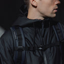a close up on the adjustable chest straps on a Roll Top 20L in Midnight Blue