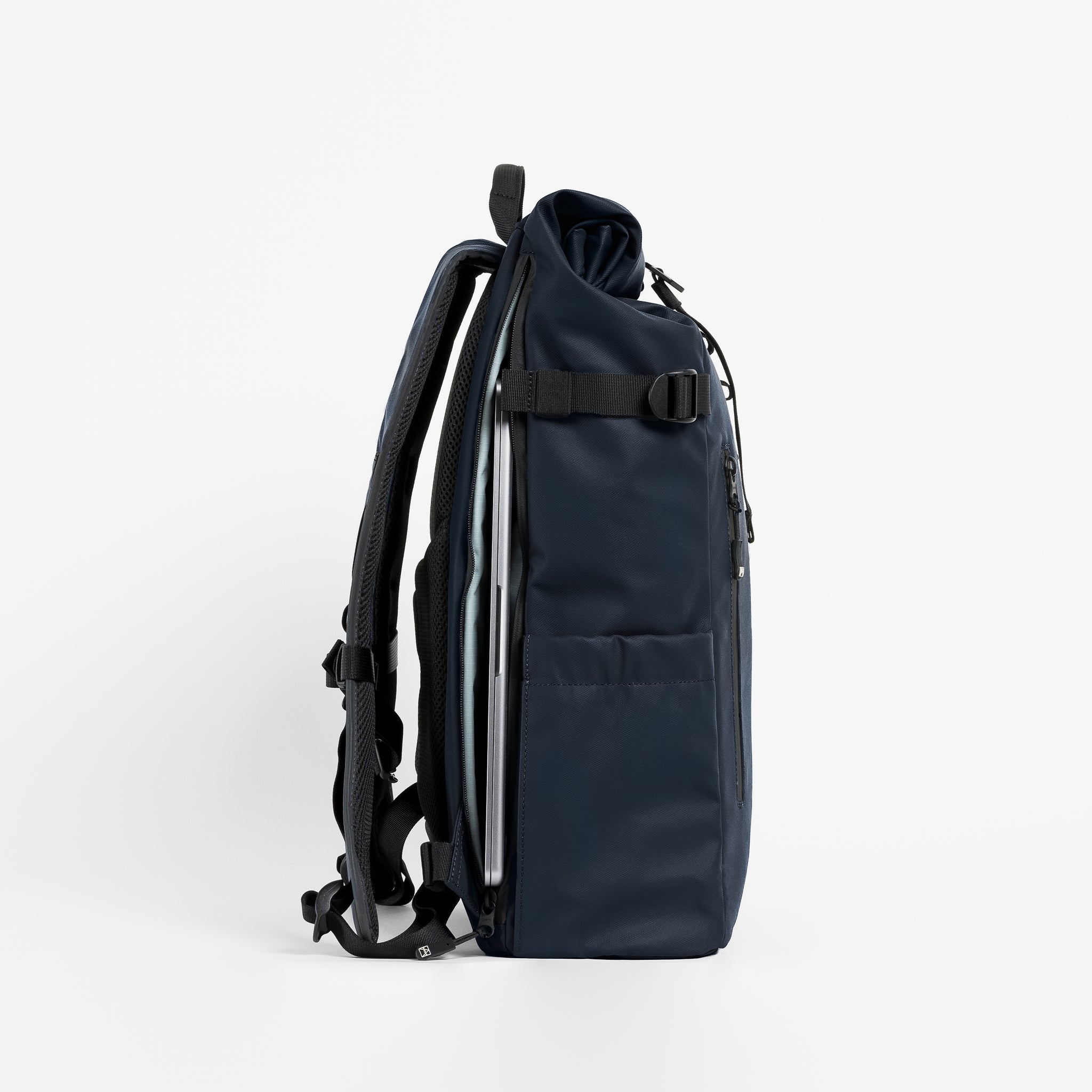 A studio shot of the laptop compartment on a Roll Top 20L in Midnight Blue