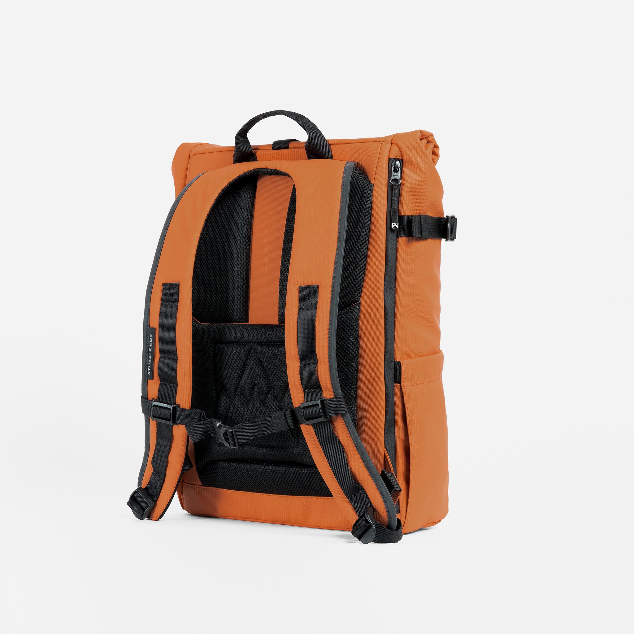 A studio shot of the back panel and adjustable chest strap on the Rust Roll Top 20L