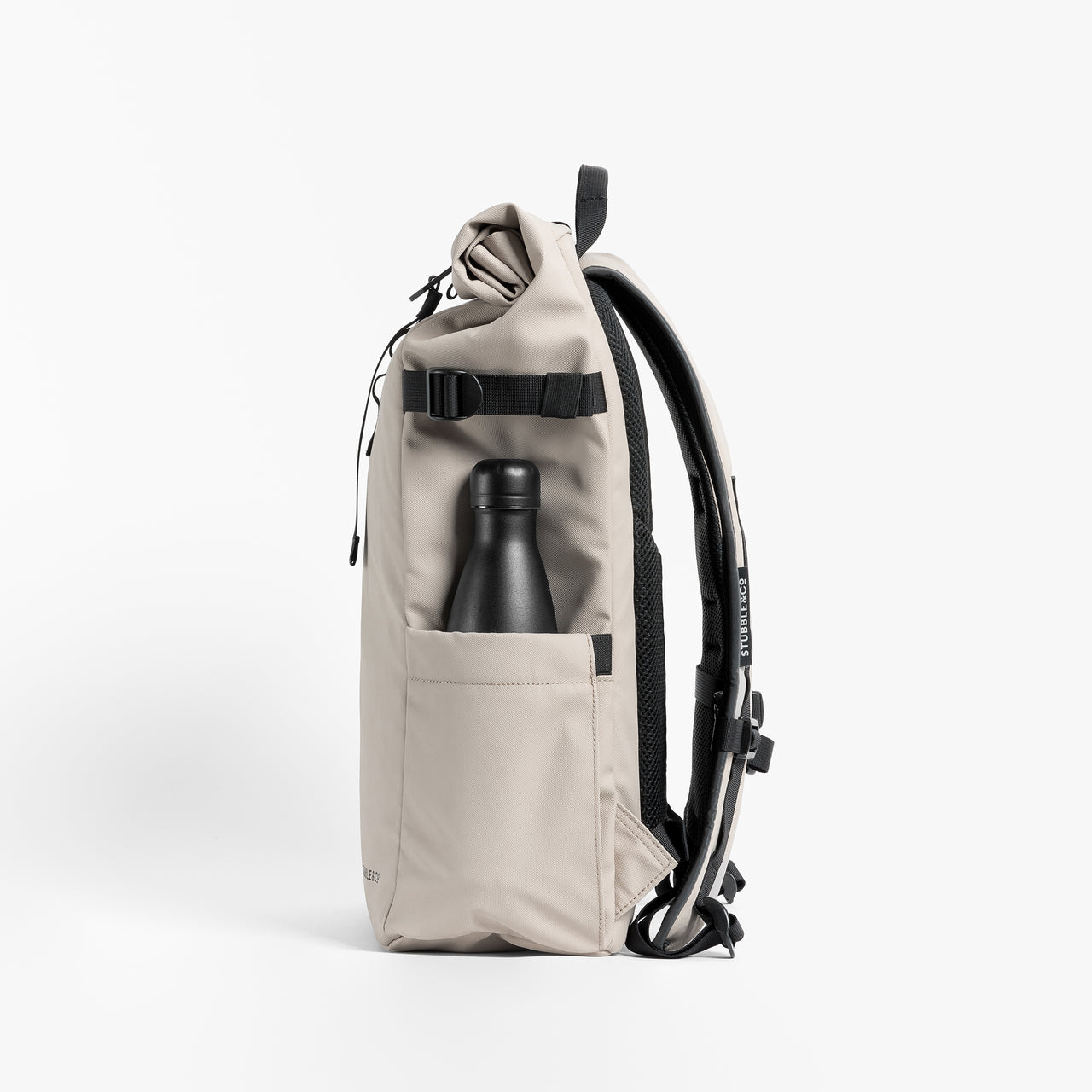 Side view of The Roll Top 20L backpack in Sand