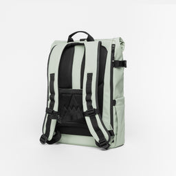 A studio shot of the back panel and adjustable chest strap on the Soft Mint Roll Top 20L