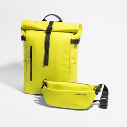 A studio shot of the Roll Top 20L and Crossbody in Volt
