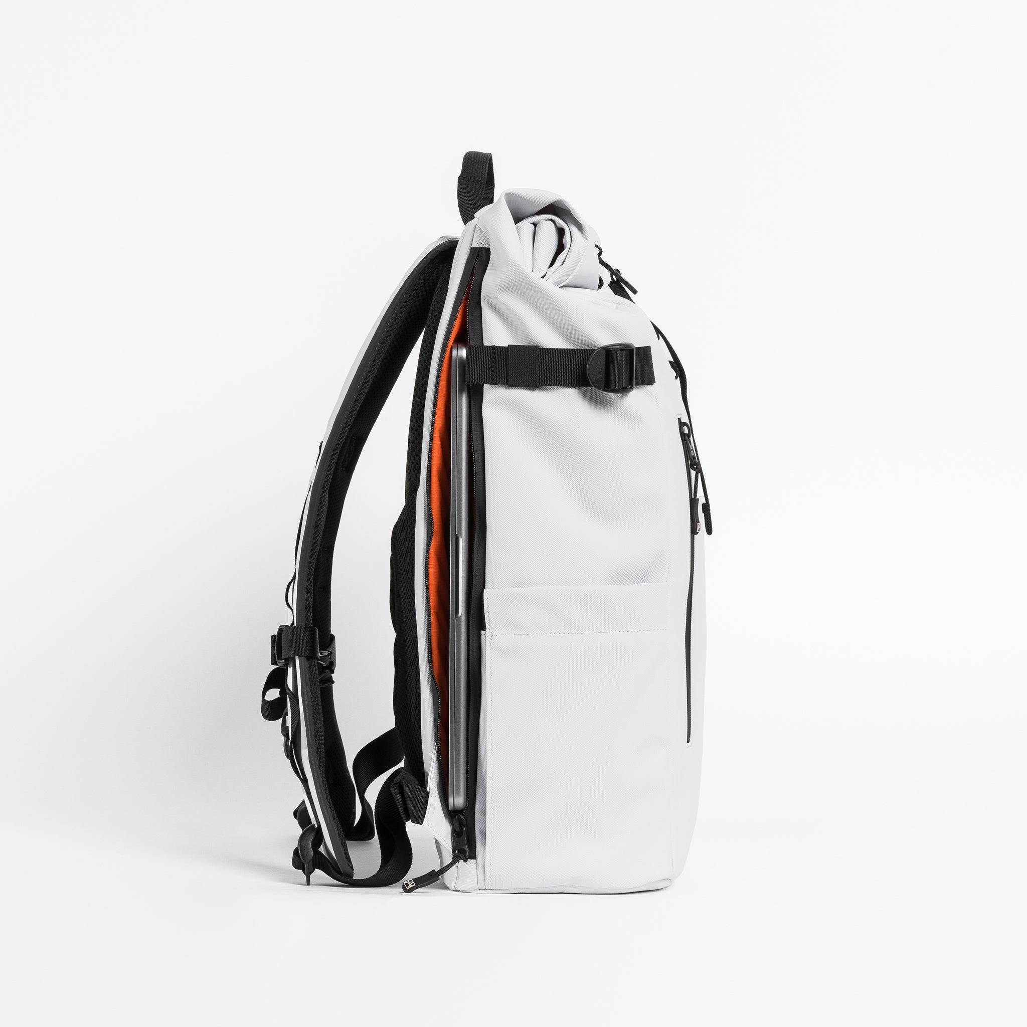 Side view of The Roll Top 20L in Arctic White with laptop compartment