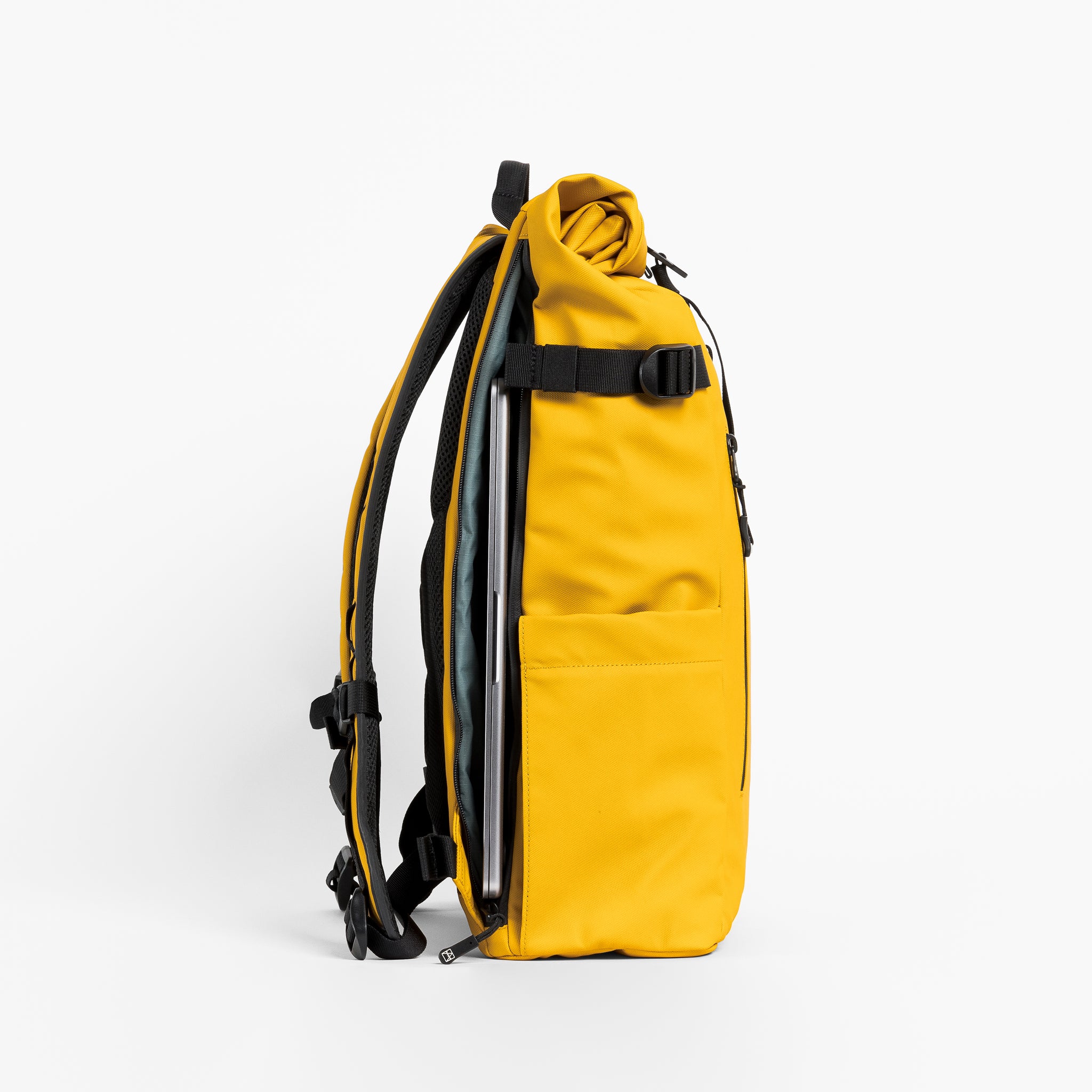a studio shot of the laptop compartment of a Yellow  roll top 20l