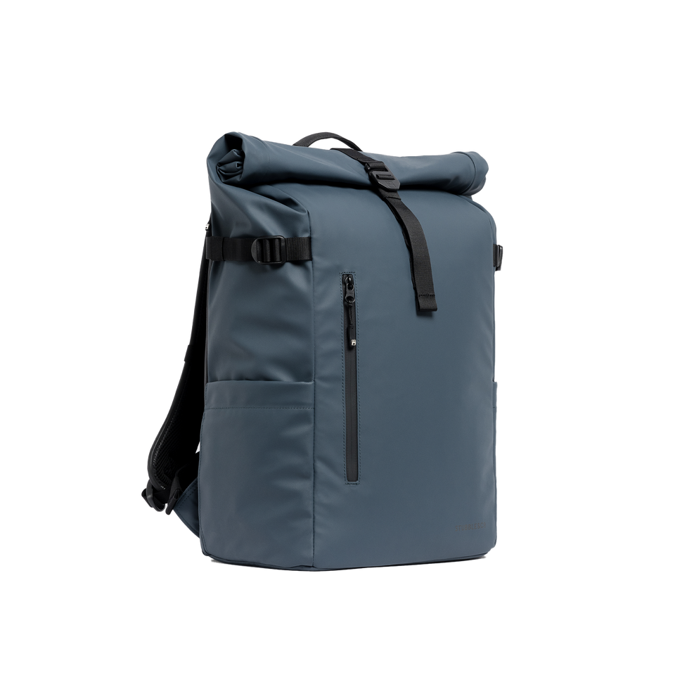 A studio shot of the front and side of a Roll Top 30L as cut out transparent PNG- blue