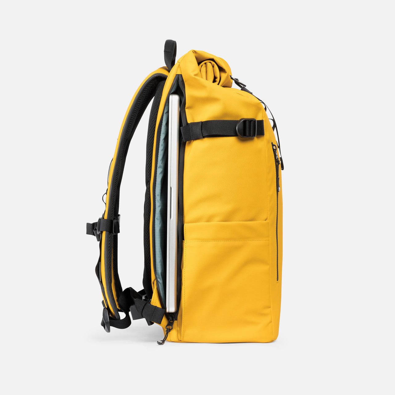 A studio shot of the laptop compartment on the Roll Top 30L in Yellow
