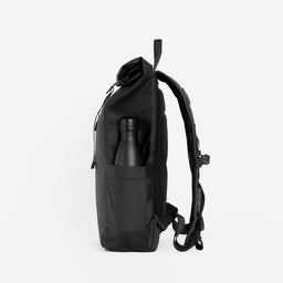 a studio shot of the bottle pocket of an All Black roll top mini