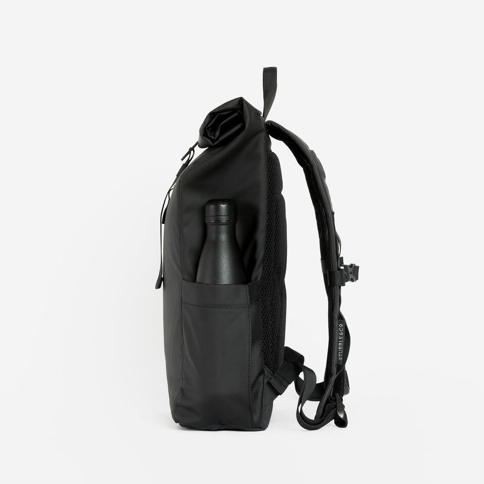 a studio shot of the bottle pocket of an All Black roll top mini