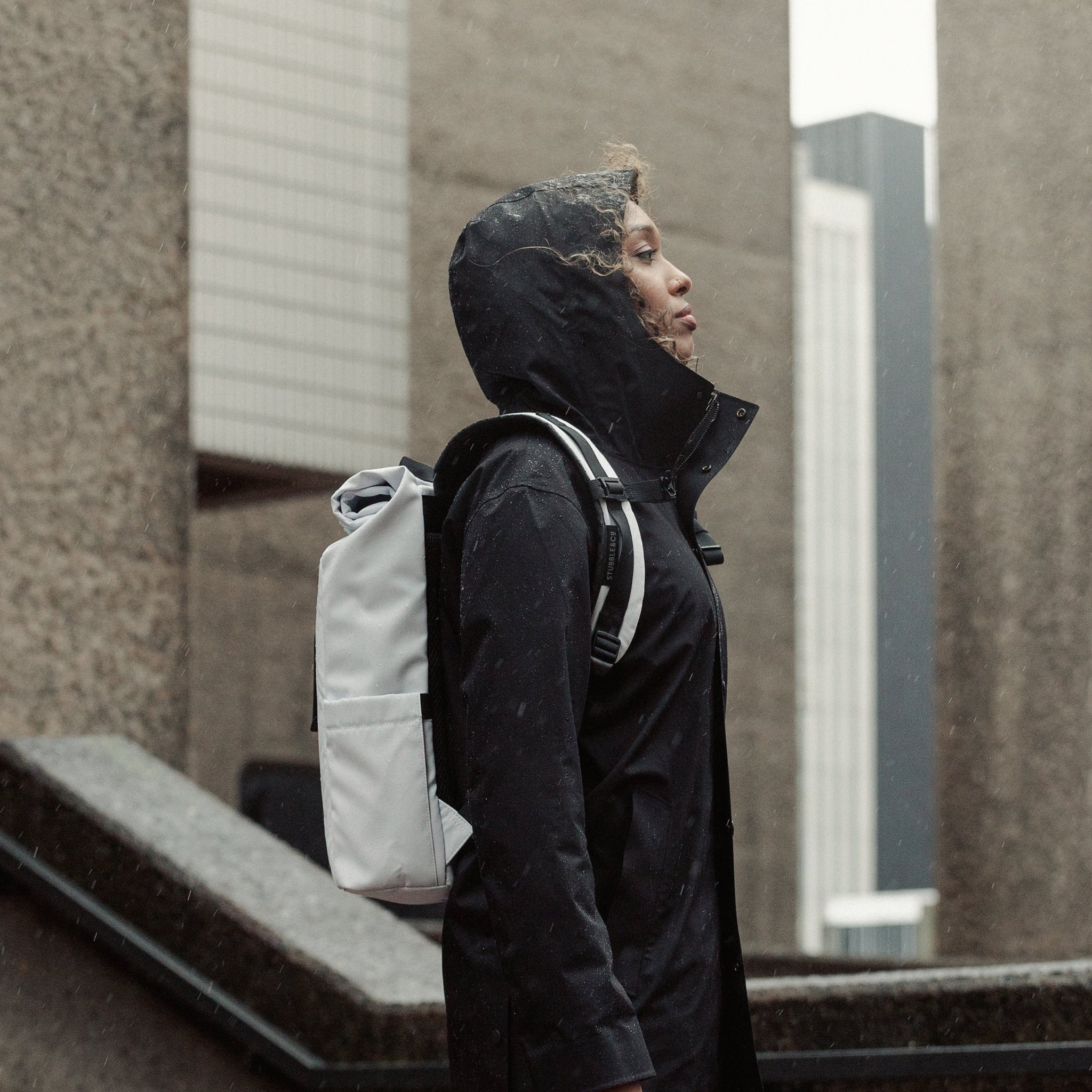 Women wearing Roll Top Mini backpack in Arctic White