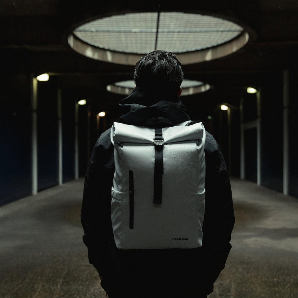 Man wearing Roll Top Mini backpack in Arctic White