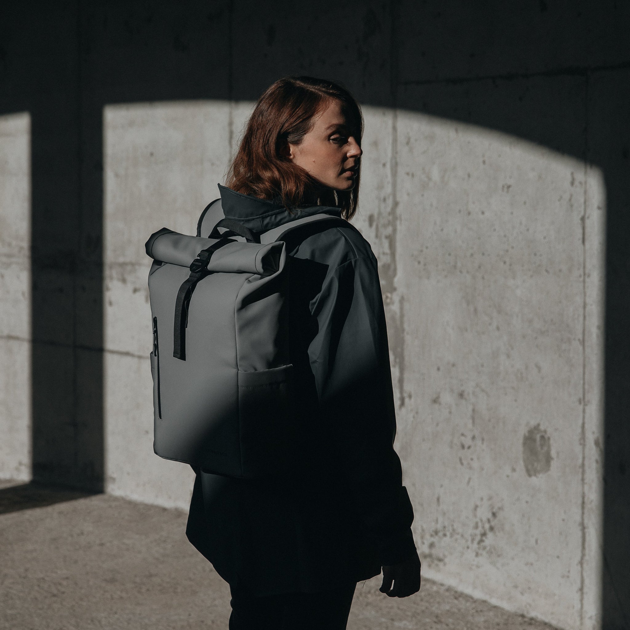 Women wearing Roll Top Mini backpack in Concrete
