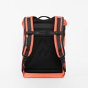A studio shot of the back panel of a Roll Top Mini backpack in Ember Orange