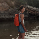 Women with Roll Top Mini backpack in Ember Orange