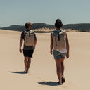 Man and women with Roll Top Mini backpack in Sand