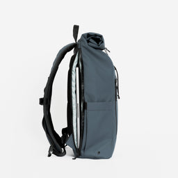 a studio shot of the laptop compartment on a Tasmin Blue roll top mini