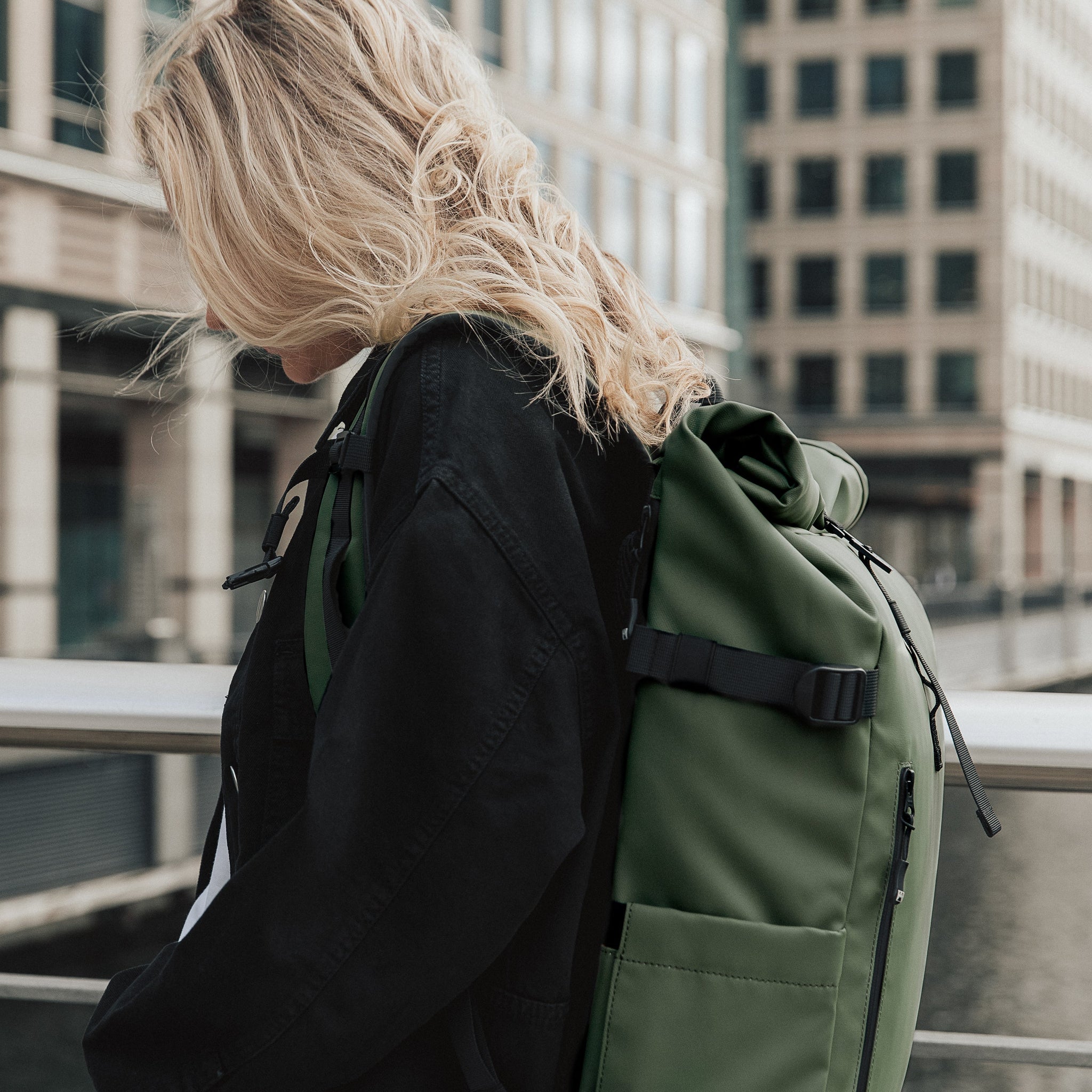 Side view of a women wearing The Roll Top in Urban Green