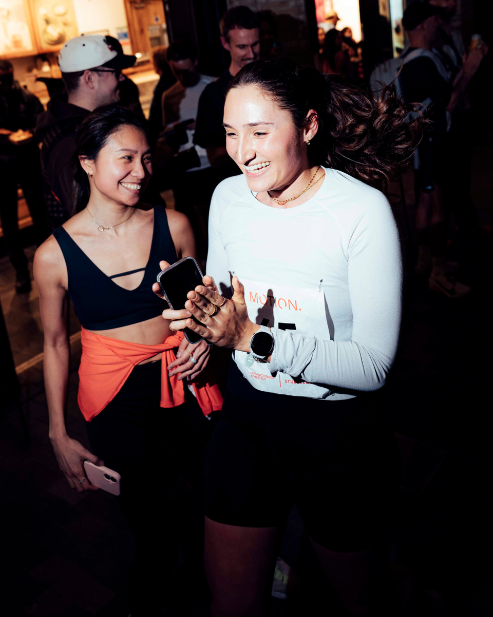 A woman celebrating after finishing her run