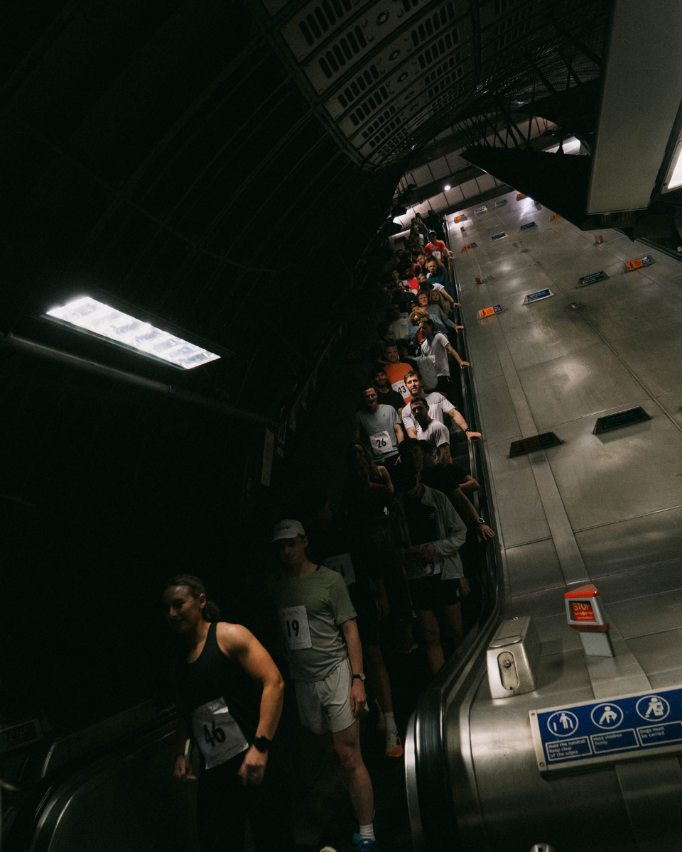 A group of runners on the tube esculator