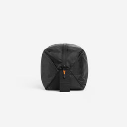 A studio shot of the end and grab handle of the shoe bag in All Black