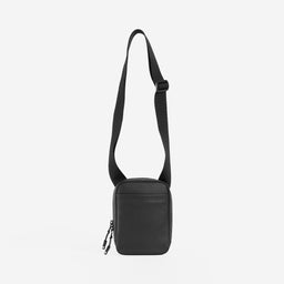 A studio shot of the long shoulder strap on All Black shoulder bag