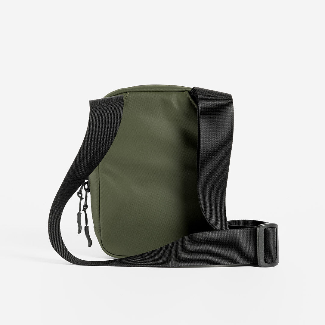 a studio shot of the back of an Urban Green shoulder bag