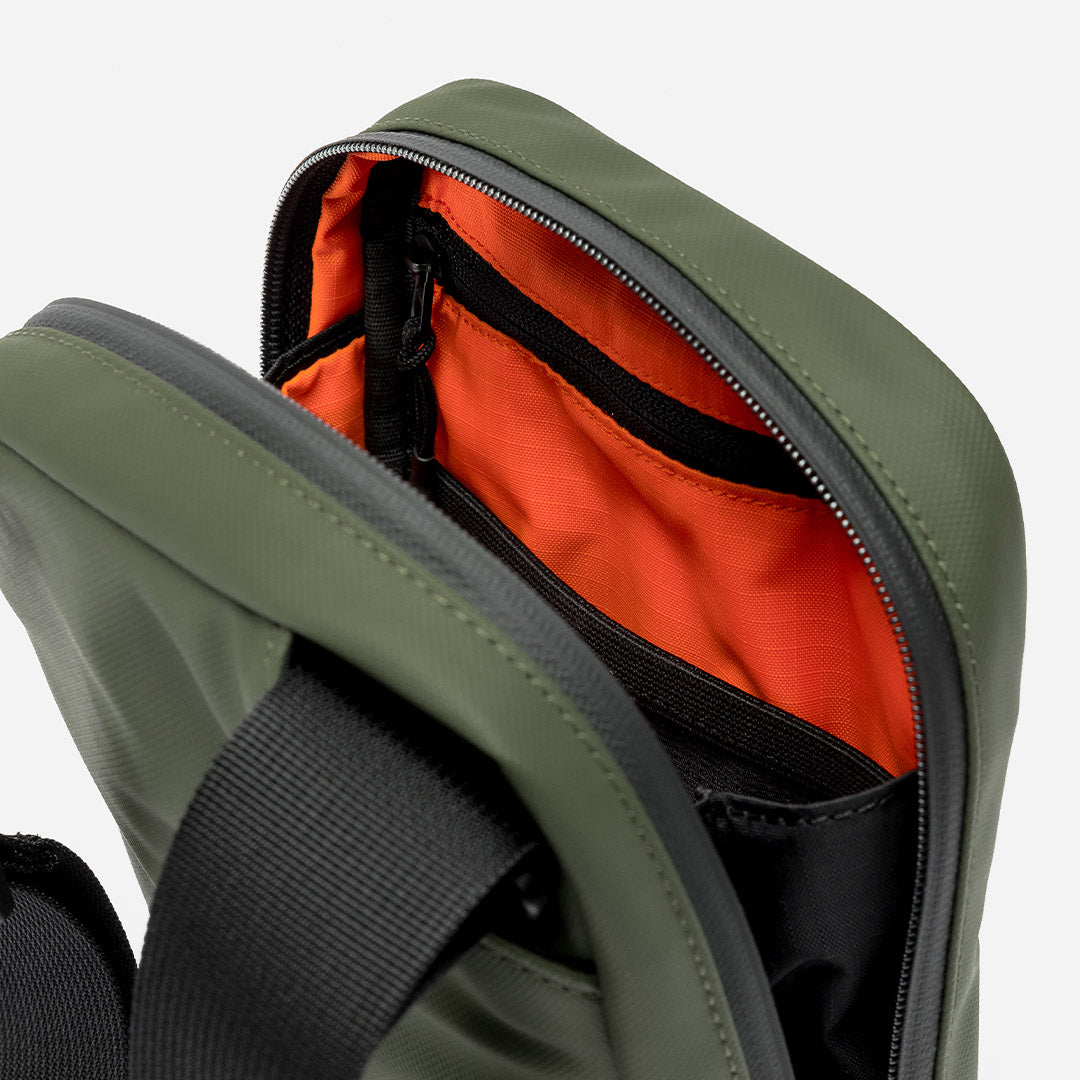 a studio shot of the interior lining and pockets on an Urban Green shoulder bag