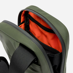 a studio shot of the interior lining and pockets on an Urban Green shoulder bag