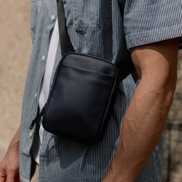 A close up of a man wearing a Midnight Blue Shoulder Bag