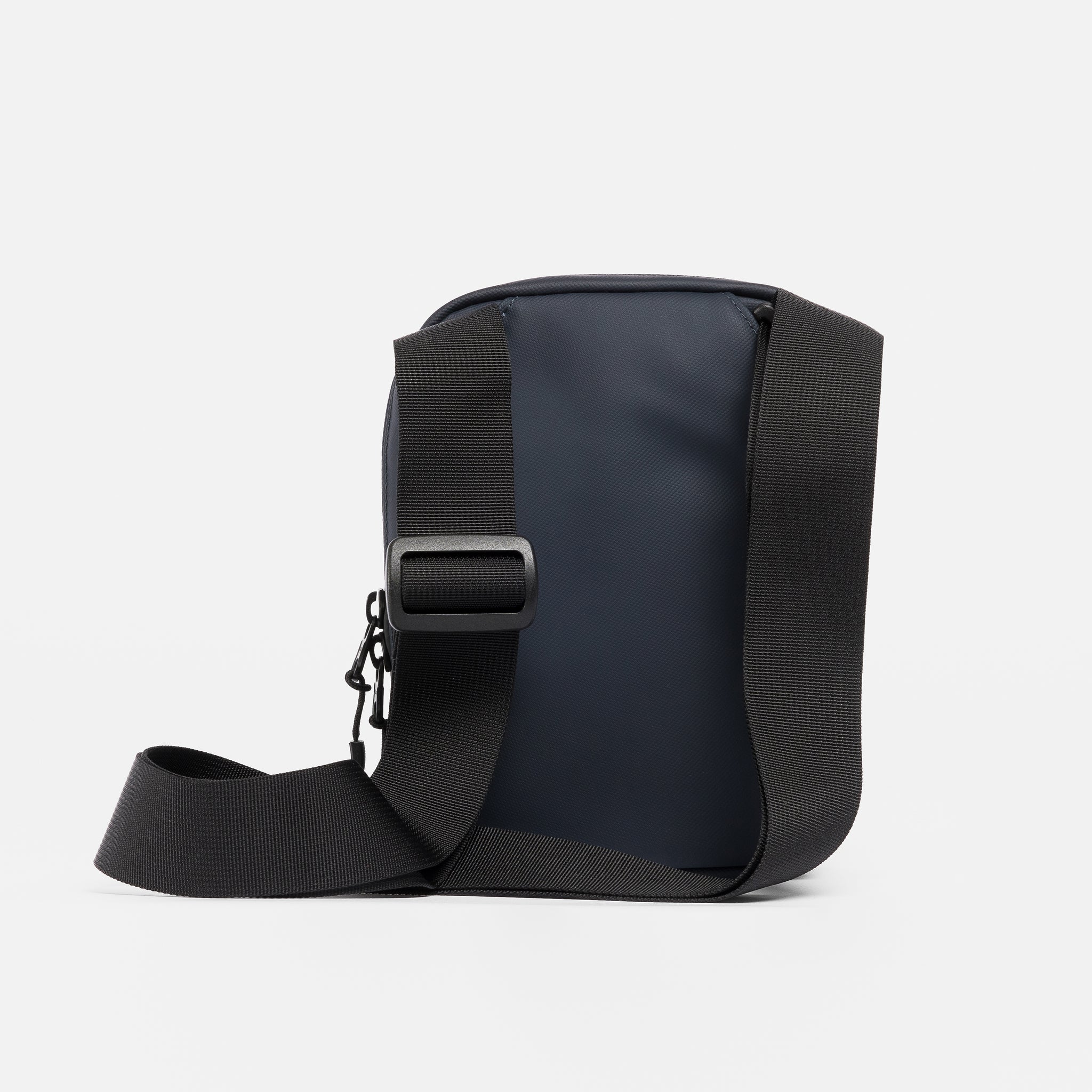 A studio shot of the back of the Shoulder Bag in Midnight Blue