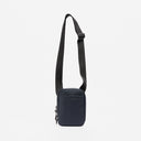 A studio shot of the Shoulder Bag in Midnight Blue hanging from the strap